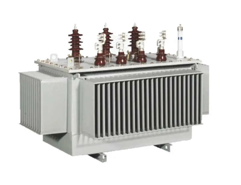 High-voltage power transformer installed at an electrical substation with bushings, cooling radiators, and overhead transmission connections.