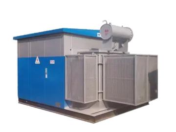 A studio-quality image of a grey oil-immersed distribution transformer featuring a corrugated cooling tank, high-voltage porcelain bushings on top, and a protective external housing for terminal connections.