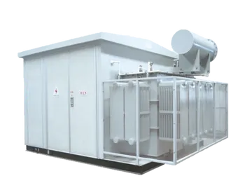 A massive industrial power transformer with high-voltage porcelain bushings and large radiator cooling banks, secured on a flatbed transport trailer for delivery to a utility site.