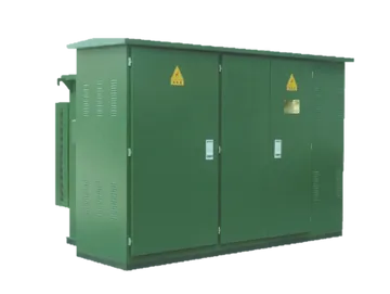 A massive industrial power transformer with high-voltage porcelain bushings and large radiator cooling banks, secured on a flatbed transport trailer for delivery to a utility site.